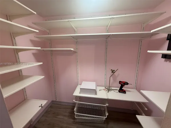 a room with a bed and a desk