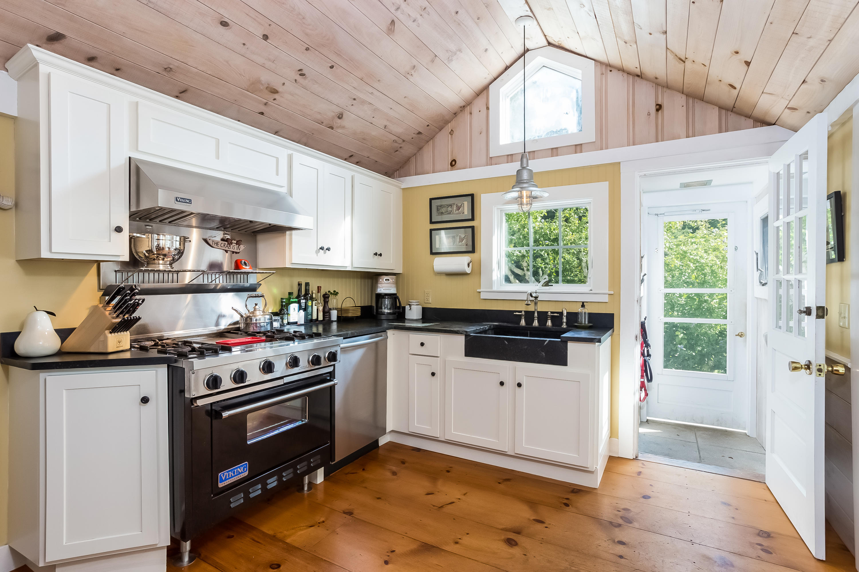 1189 County Road Cataumet, MA 02534 - Photo 3 of 25 a kitchen with a stove a sink and a window