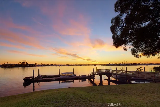 a view of a lake with outdoor seating