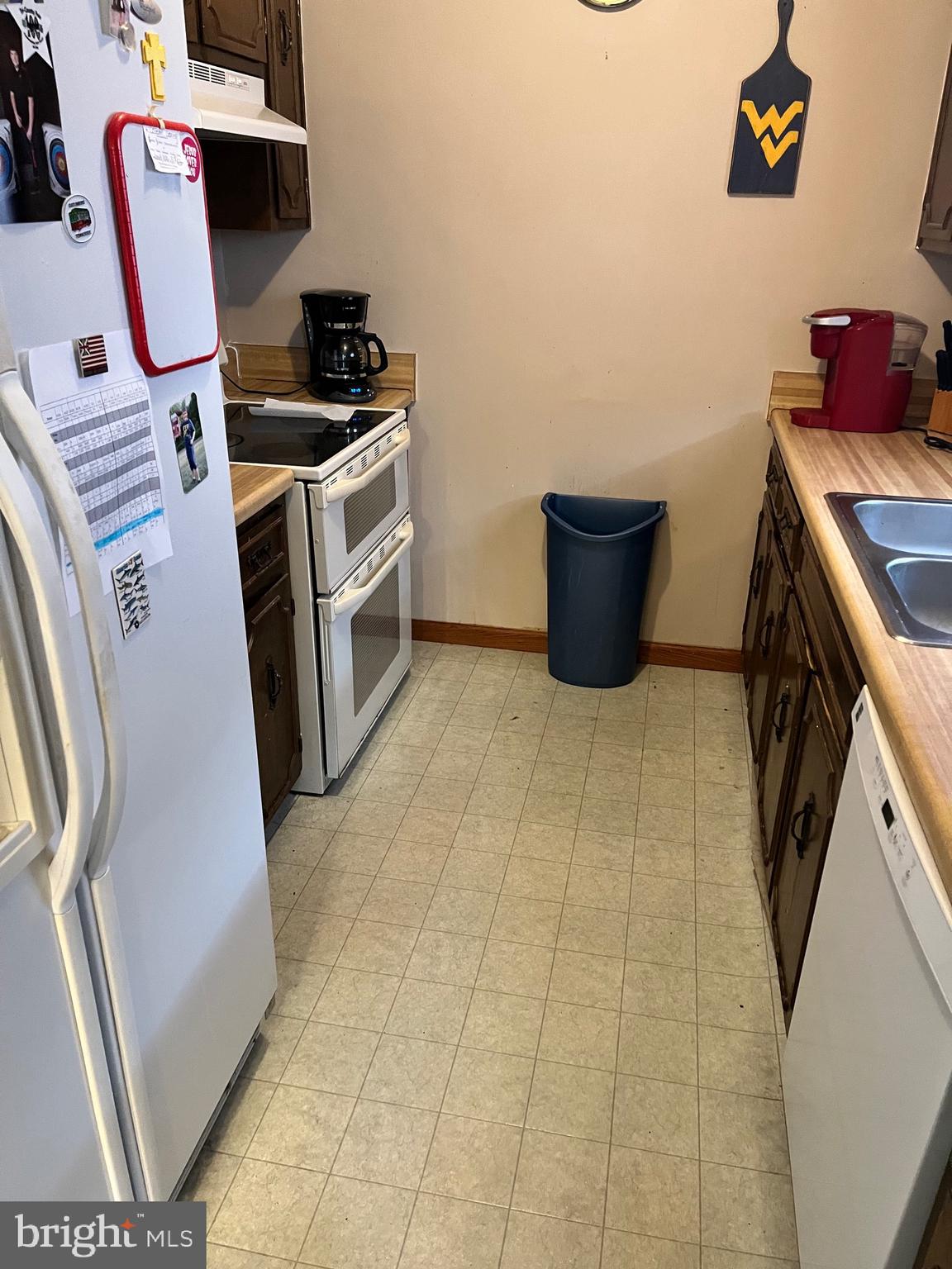2166 Country Road Maysville, WV 26833 - Photo 14 of 54 a kitchen with a stove and a refrigerator
