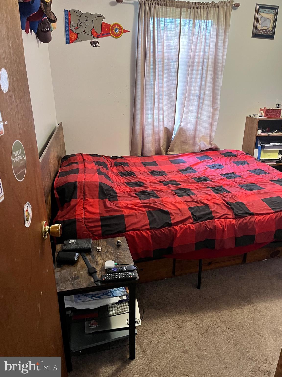 2166 Country Road Maysville, WV 26833 - Photo 17 of 54 a bedroom with a bed and a dresser