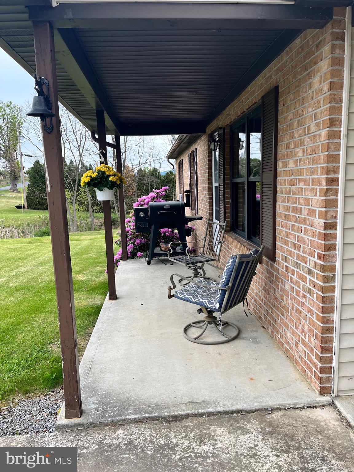 2166 Country Road Maysville, WV 26833 - Photo 3 of 54 a view of a porch with furniture and garden