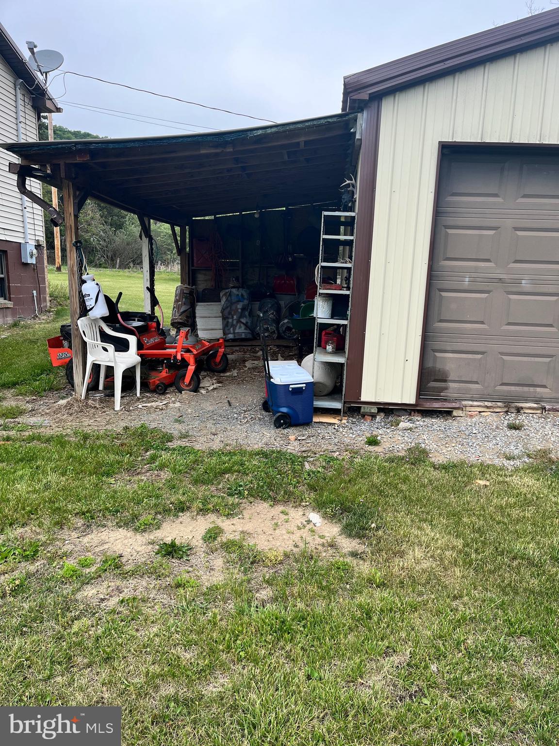 2166 Country Road Maysville, WV 26833 - Photo 52 of 54 a view of a backyard with table and chairs under an umbrella