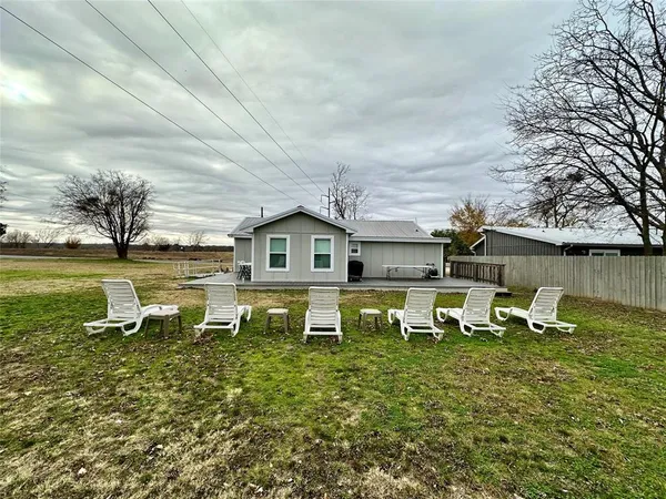 a front view of a house with a lake view