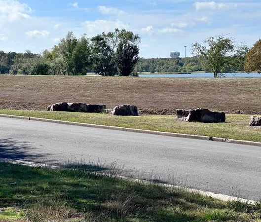 a view of a yard with an ocean