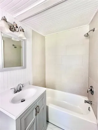 a bathroom with a sink and a bathtub