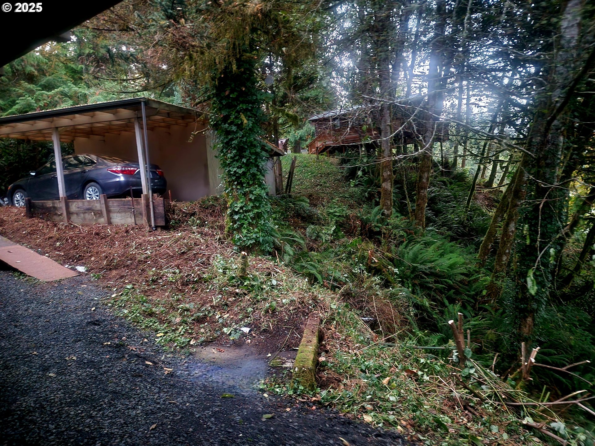 96015 Sun Lake Lane Lakeside, OR 97449 - Photo 12 of 46 a backyard of a house with barbeque oven table and chairs