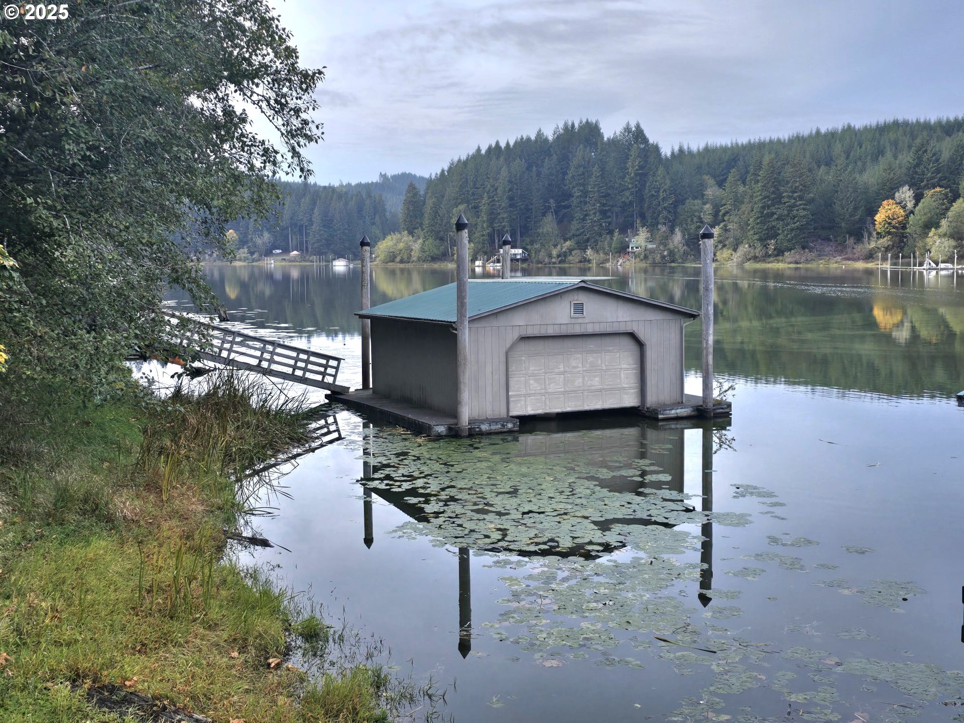 96015 Sun Lake Lane Lakeside, OR 97449 - Photo 26 of 46 a view of a wooden bridge and lake view