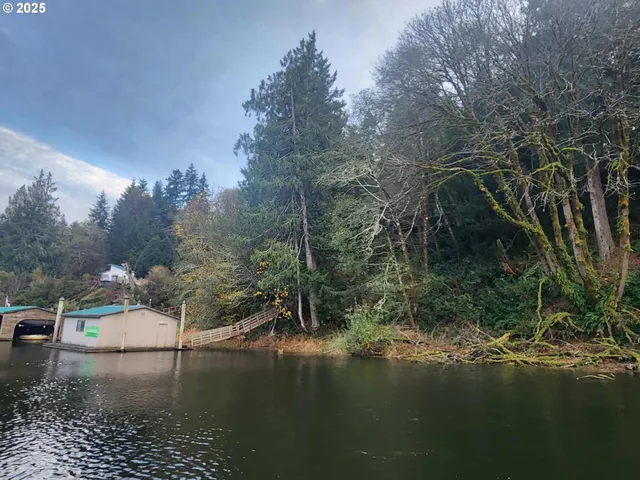 a view of a balcony with wooden floor and fence