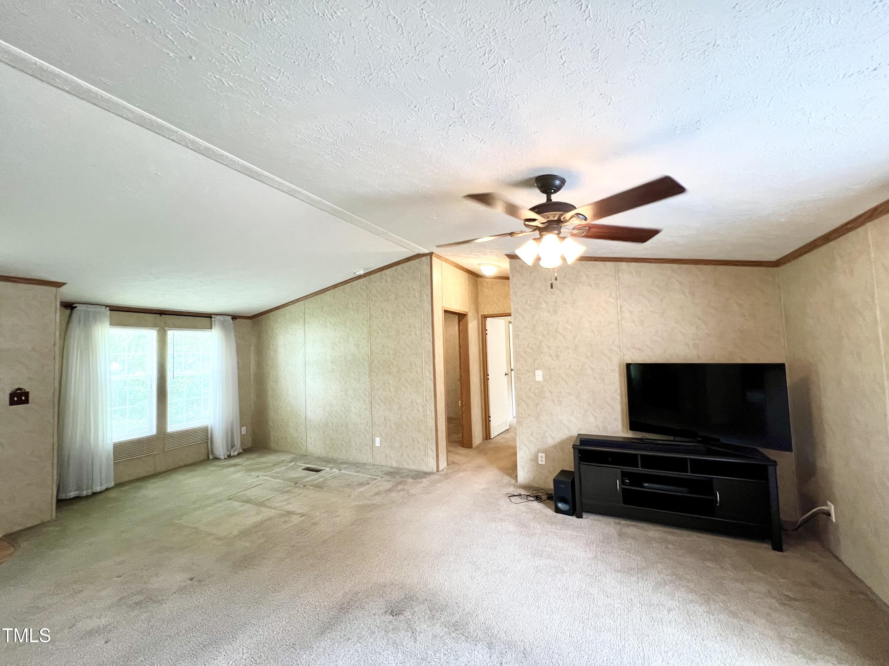 665 Christys Way Roxboro, NC 27574 - Photo 3 of 57 a living room with furniture and a flat screen tv