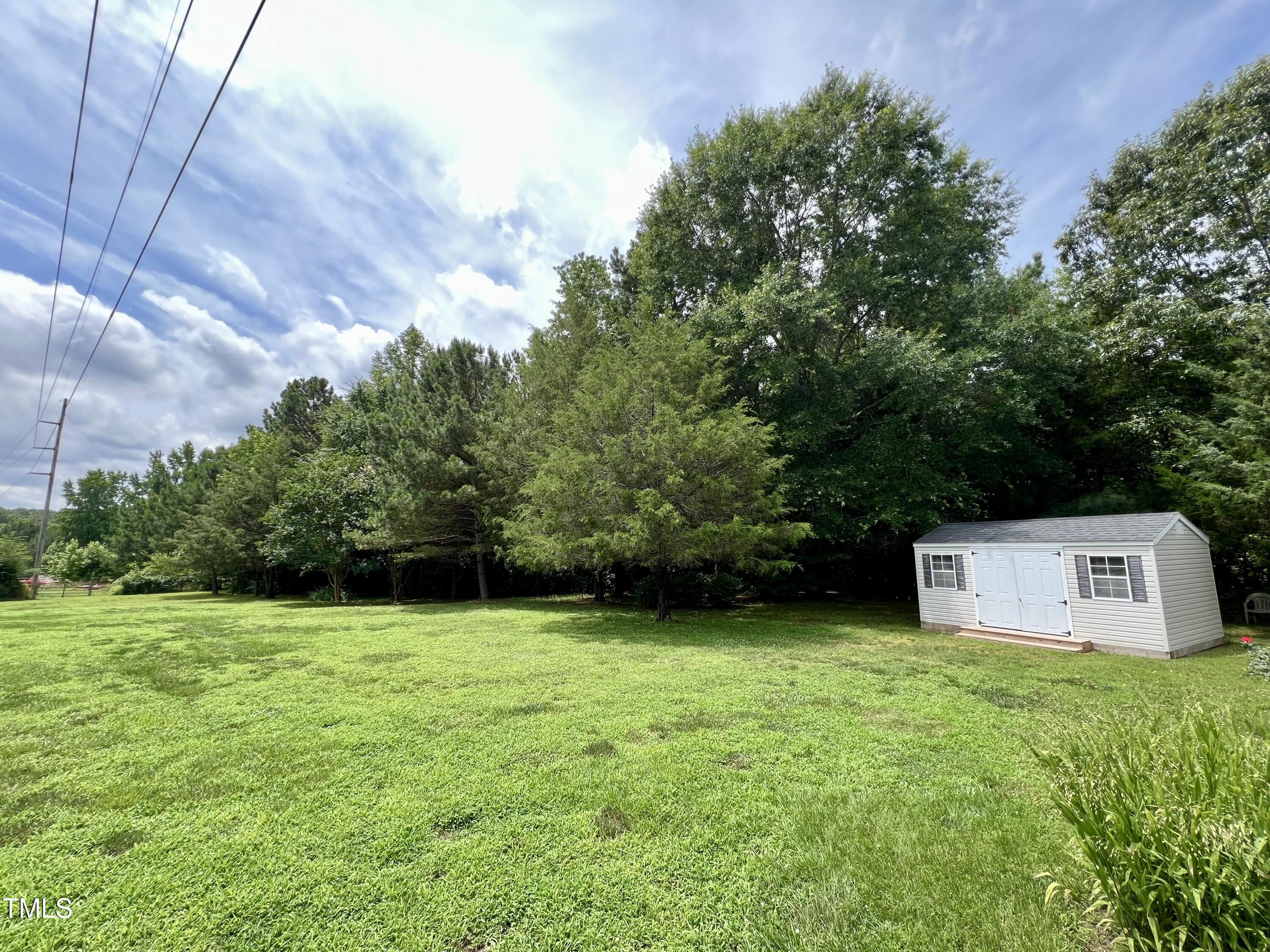 665 Christys Way Roxboro, NC 27574 - Photo 48 of 57 a view of a house with a yard