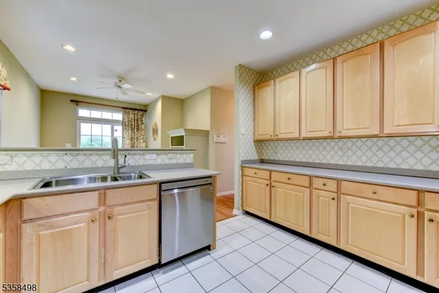 a kitchen with a sink and cabinets