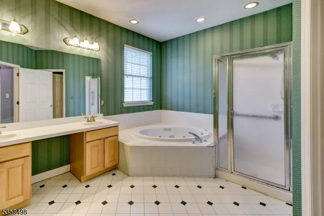 a bathroom with a bathtub and a sink
