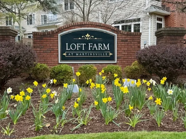 a sign broad on the brick wall