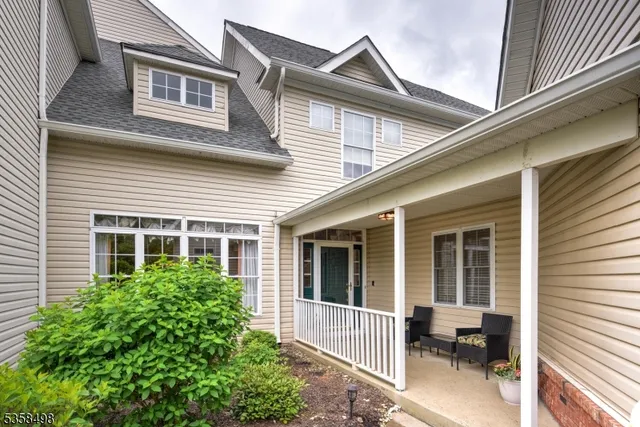 a view of a house with a chair and a table and chairs