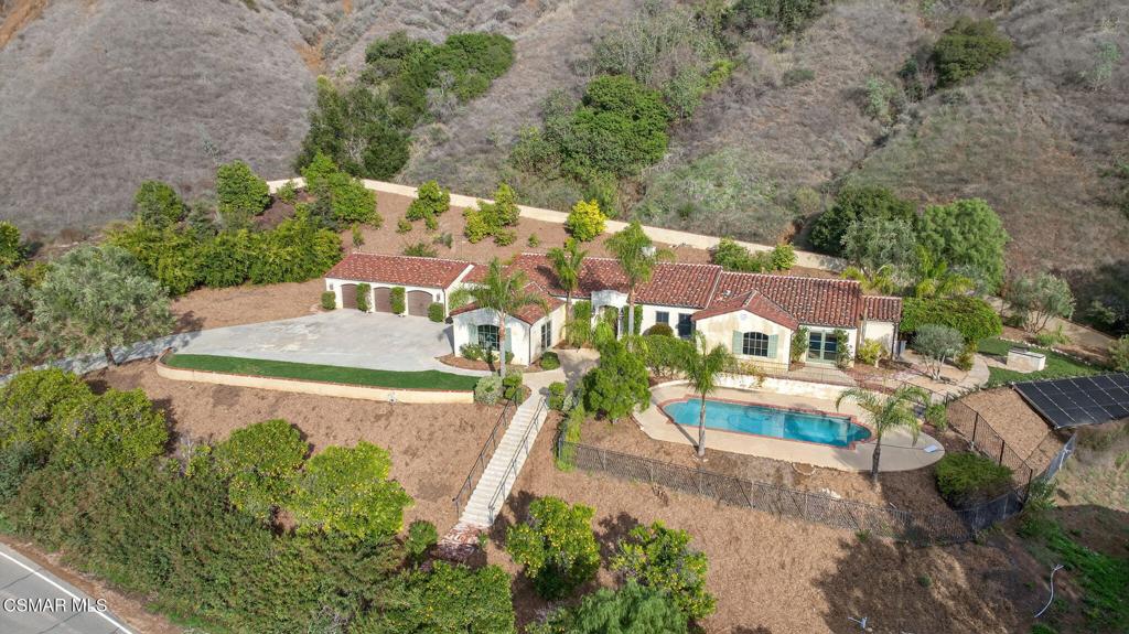 an aerial view of a house with a garden