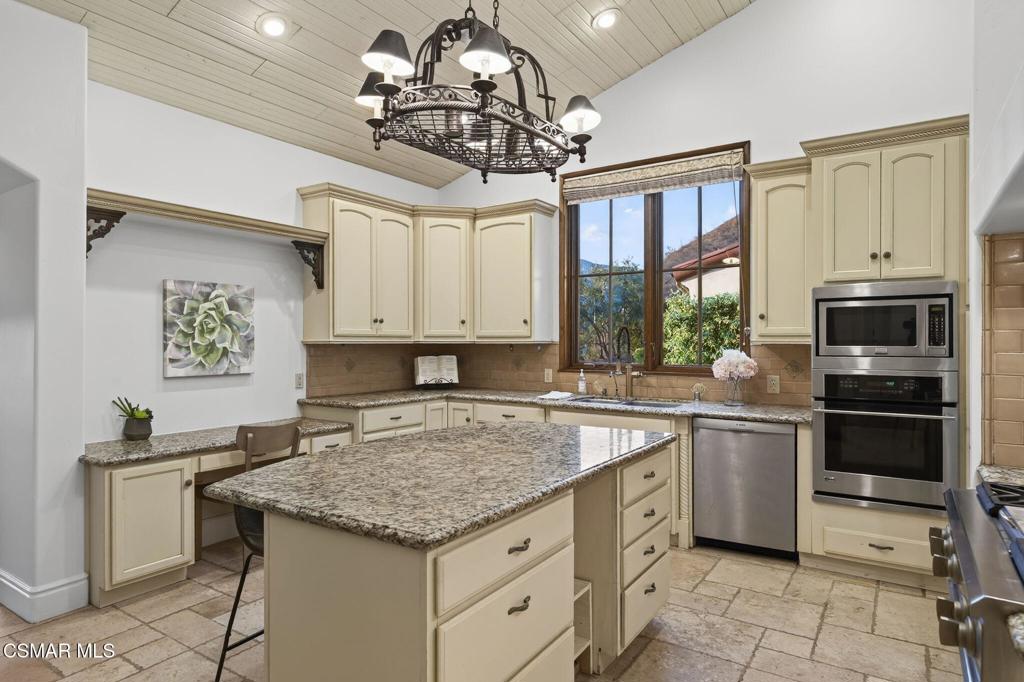 1560 Goodenough Road Fillmore, CA 93015 - Photo 12 of 76 a kitchen with stainless steel appliances granite countertop a sink stove and refrigerator