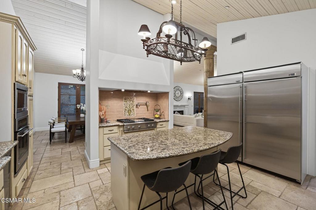 1560 Goodenough Road Fillmore, CA 93015 - Photo 20 of 76 a kitchen with stainless steel appliances granite countertop a sink a refrigerator and a stove
