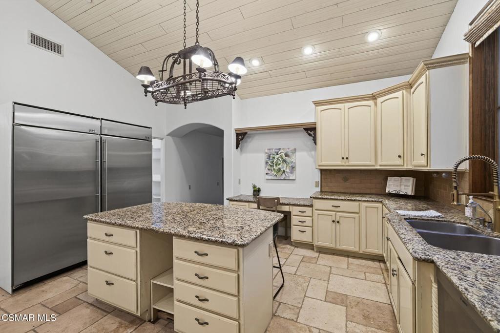 1560 Goodenough Road Fillmore, CA 93015 - Photo 21 of 76 a kitchen with granite countertop a sink stainless steel appliances and cabinets