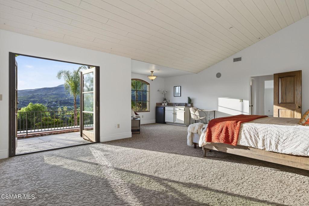 1560 Goodenough Road Fillmore, CA 93015 - Photo 26 of 76 a bedroom with a large bed and a large window