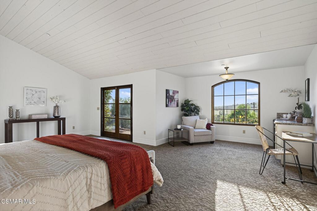 1560 Goodenough Road Fillmore, CA 93015 - Photo 28 of 76 a bedroom with a bed and large windows