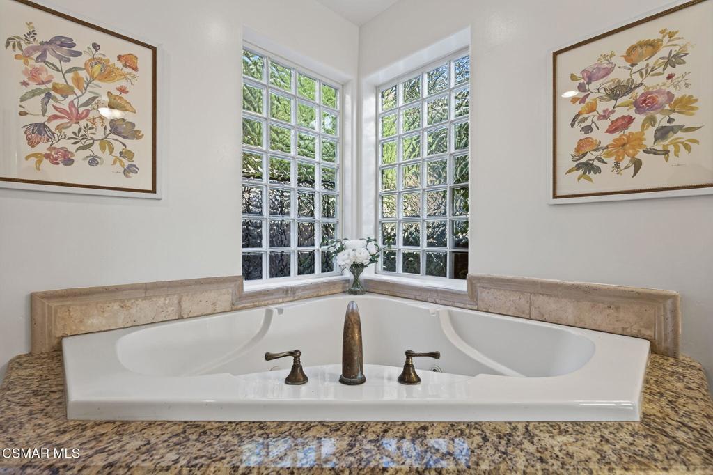 1560 Goodenough Road Fillmore, CA 93015 - Photo 33 of 76 a bath tub sitting in a bathroom next to a window