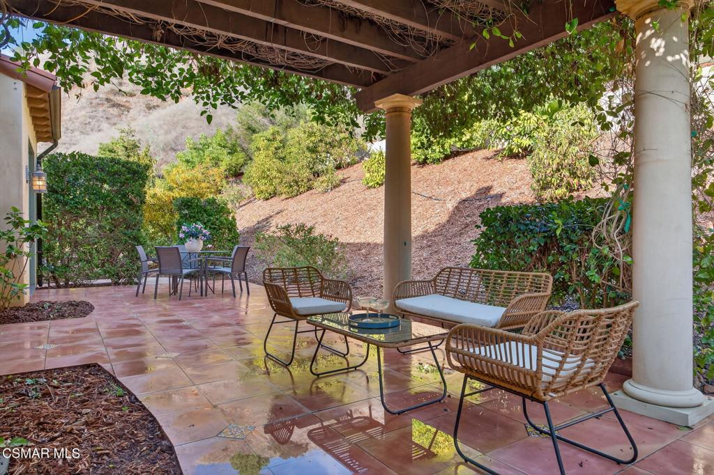 1560 Goodenough Road Fillmore, CA 93015 - Photo 42 of 76 a patio with yard glass top table and chairs