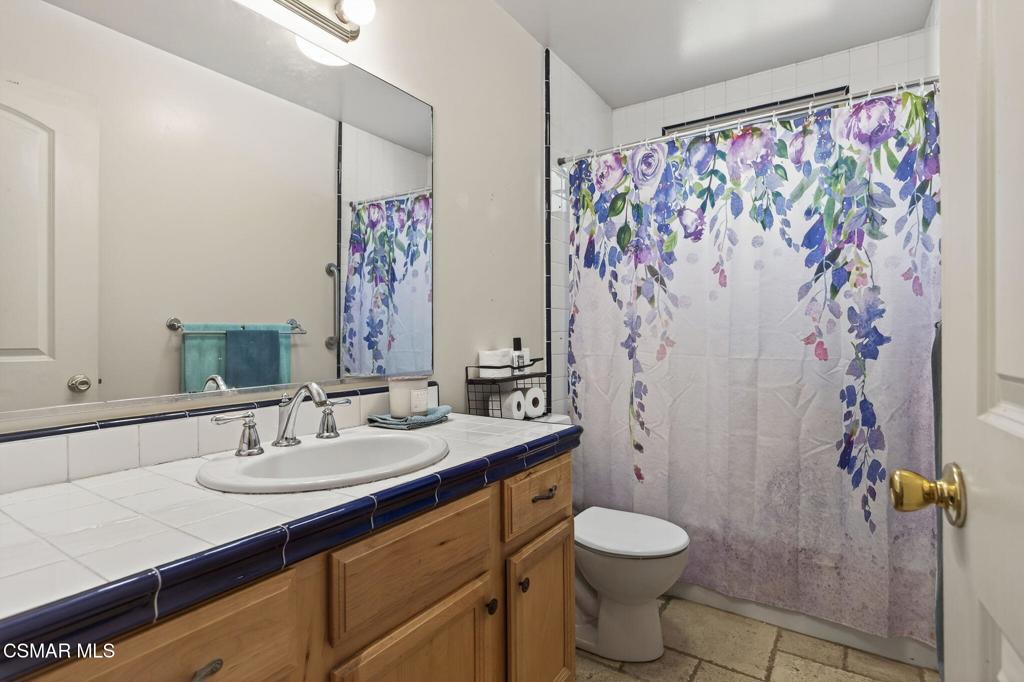 1560 Goodenough Road Fillmore, CA 93015 - Photo 50 of 76 a bathroom with a sink toilet and shower