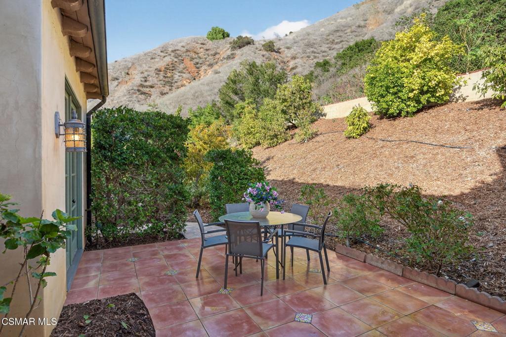 1560 Goodenough Road Fillmore, CA 93015 - Photo 57 of 76 a patio with table and chairs and potted plants