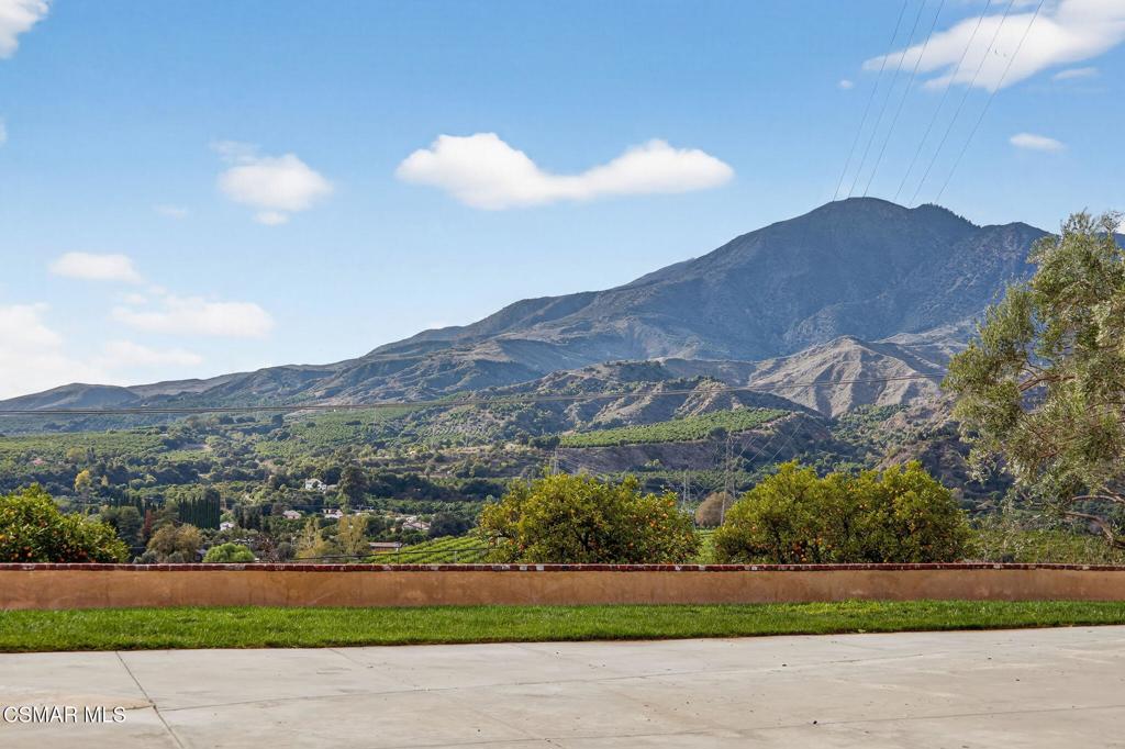 1560 Goodenough Road Fillmore, CA 93015 - Photo 62 of 76 a view of a house with a yard and a large tree
