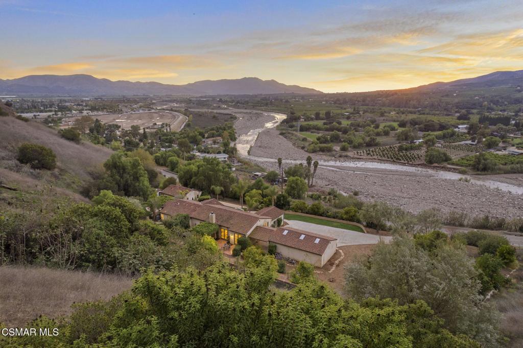 1560 Goodenough Road Fillmore, CA 93015 - Photo 66 of 76 an aerial view of green landscape with trees houses and mountain view