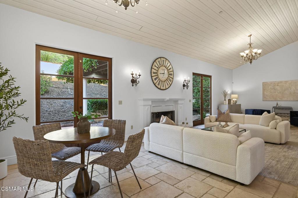 1560 Goodenough Road Fillmore, CA 93015 - Photo 7 of 76 a living room with furniture a fireplace and a large window