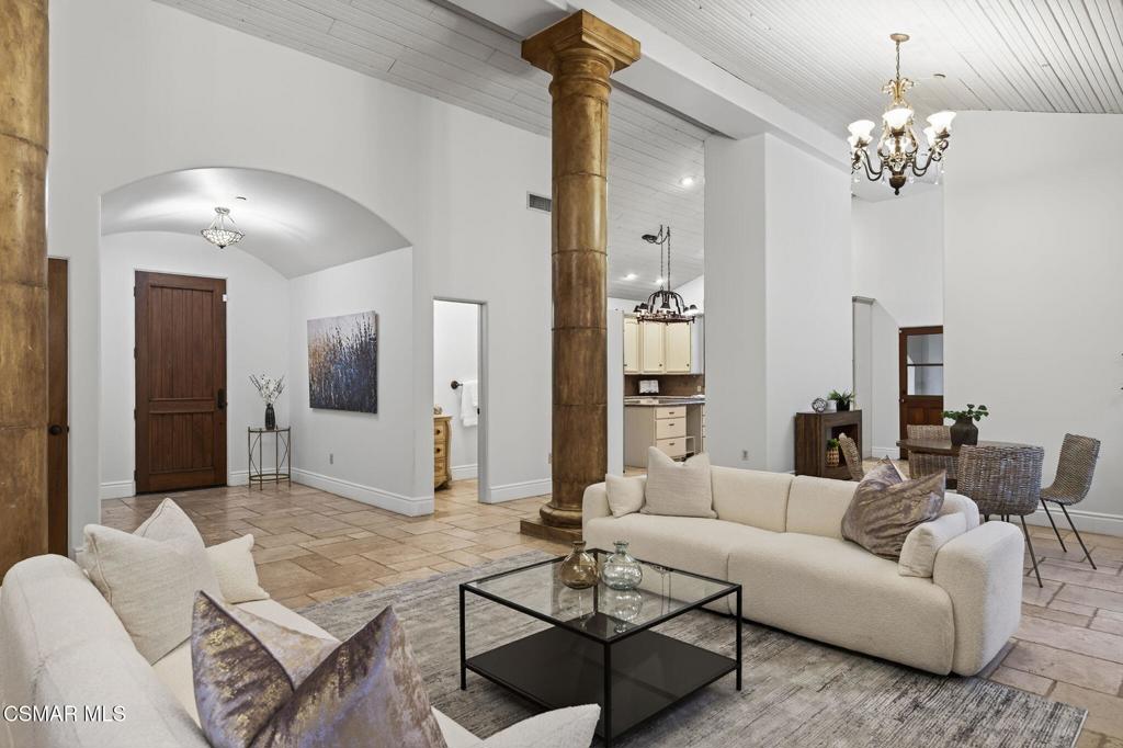 1560 Goodenough Road Fillmore, CA 93015 - Photo 8 of 76 a living room with furniture and a chandelier