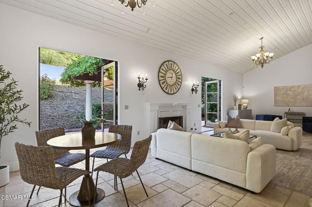 1560 Goodenough Road Fillmore, CA 93015 - Photo 9 of 76 a living room with furniture a fireplace and a large window