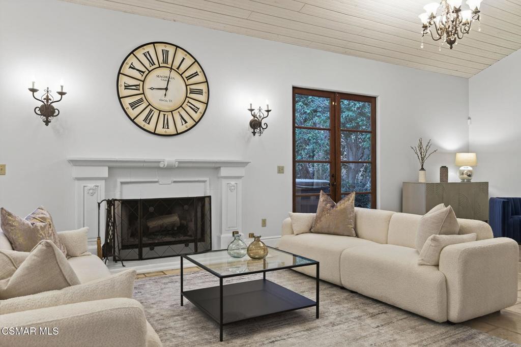 1560 Goodenough Road Fillmore, CA 93015 - Photo 10 of 76 a living room with furniture a clock and a fireplace