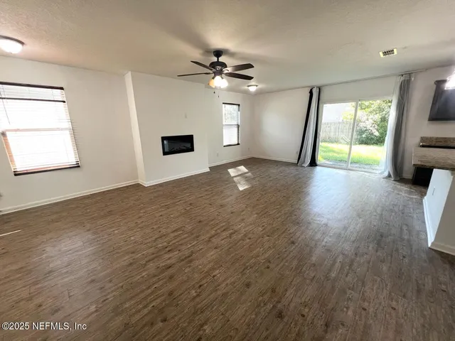a view of livingroom and hardwood floor
