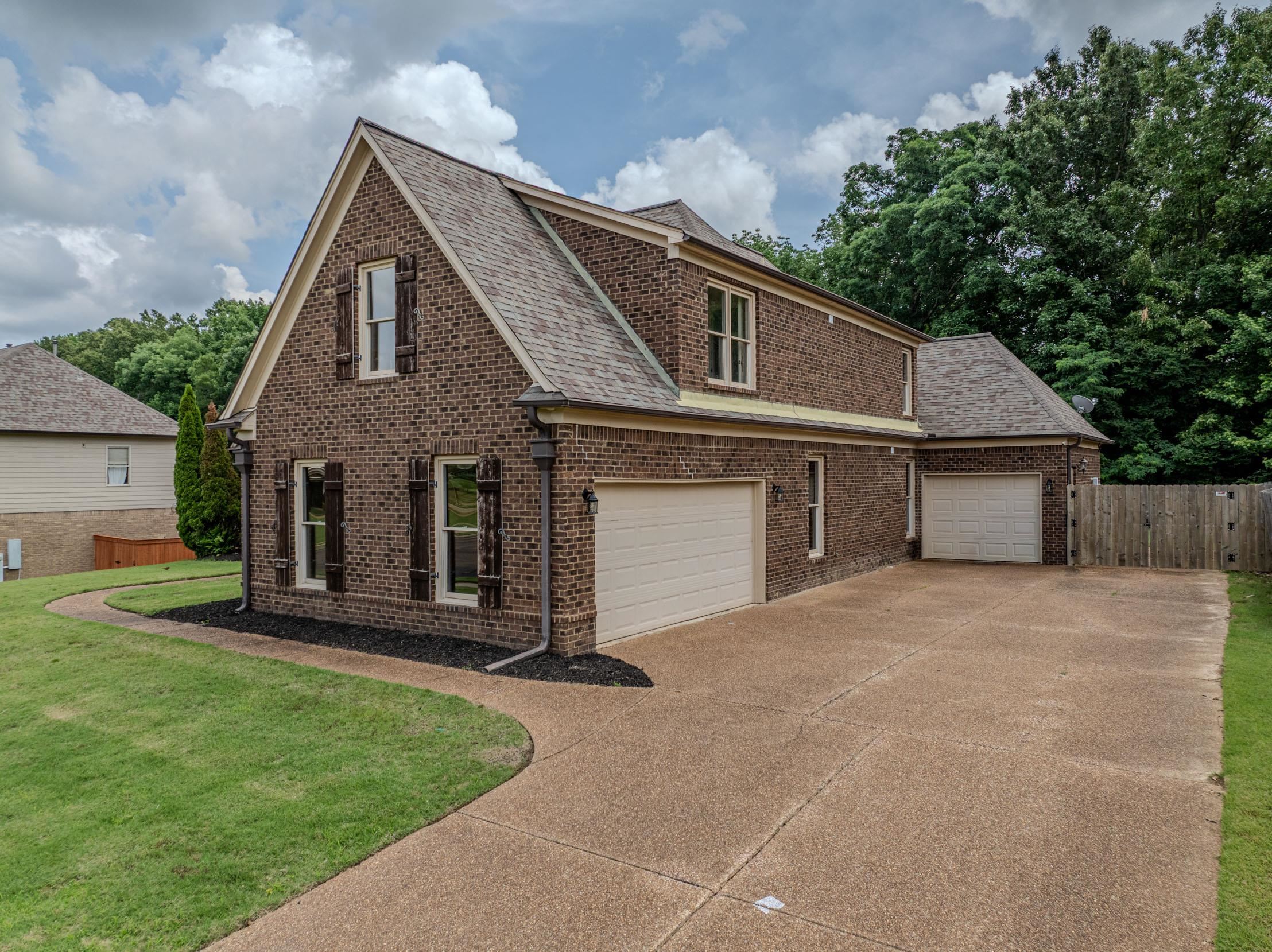 5380 Scarlet Ridge Drive Arlington, TN 38002 - Photo 35 of 35 Brick exterior with multiple gables and a shingled roof