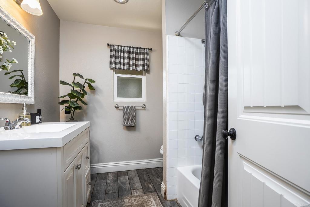 2430 Geyer Lane Alpine, CA 91901 - Photo 18 of 60 a bathroom with a sink a mirror and a shower