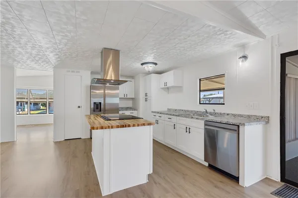 a kitchen with a stove and cabinets