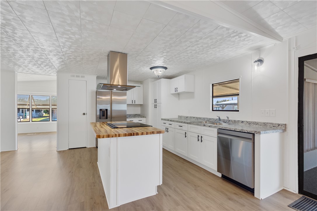 908 Oleander Circle Sebastian, FL 32976 - Photo 11 of 36 a kitchen with a stove and cabinets