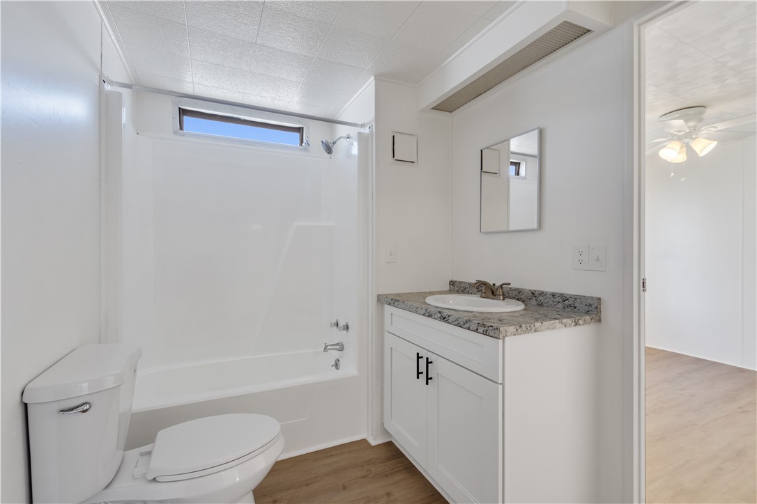 908 Oleander Circle Sebastian, FL 32976 - Photo 20 of 36 a bathroom with a granite countertop sink toilet and shower