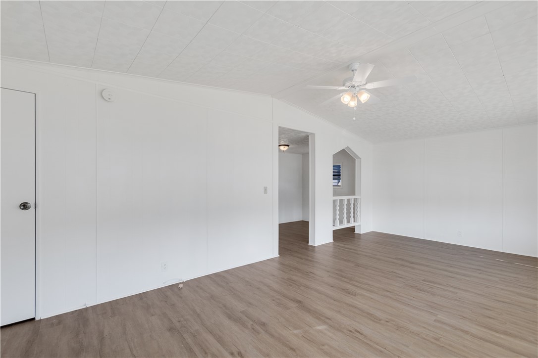 908 Oleander Circle Sebastian, FL 32976 - Photo 4 of 36 a view of an empty room with wooden floor