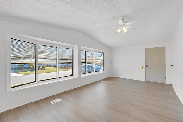 a view of an empty room with a window