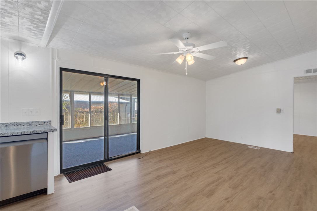 908 Oleander Circle Sebastian, FL 32976 - Photo 10 of 36 wooden floor in an empty room with a window