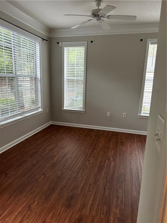 5208 Westchester Ridge Northeast Atlanta, GA 30329 - Photo 13 of 32 a view of an empty room with wooden floor and a window