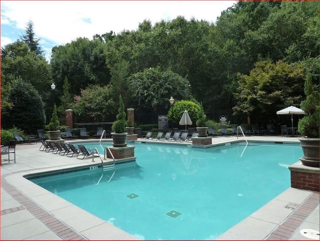 5208 Westchester Ridge Northeast Atlanta, GA 30329 - Photo 25 of 32 a view of a swimming pool with chairs
