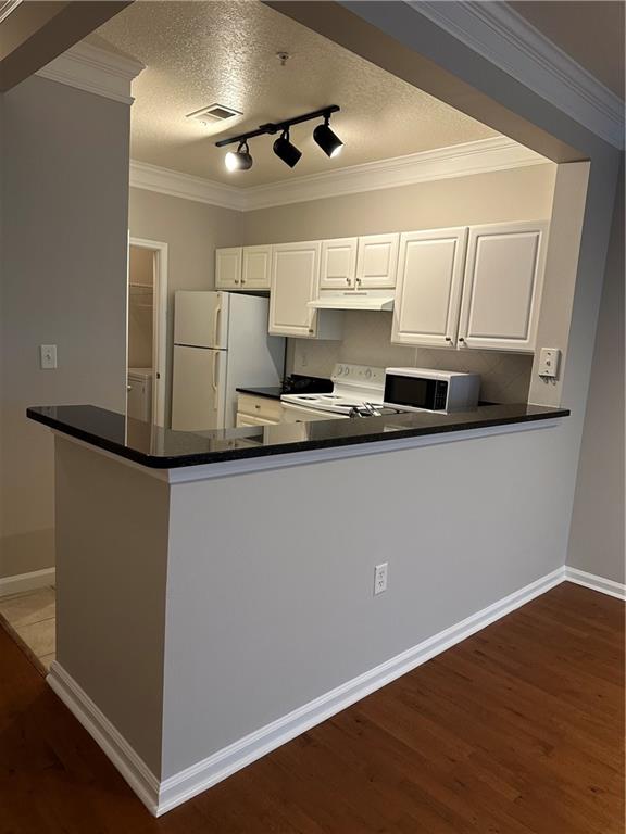 5208 Westchester Ridge Northeast Atlanta, GA 30329 - Photo 3 of 32 a kitchen with stainless steel appliances a sink a stove a refrigerator and cabinets