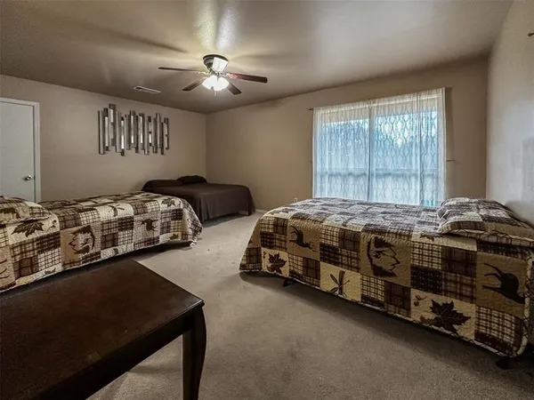 a bedroom with bed and a window