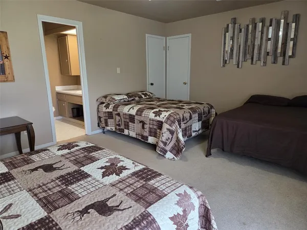 a bedroom with a bed and a table in it