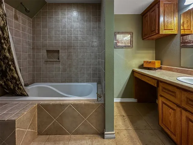 a bathroom with a sink and cabinets